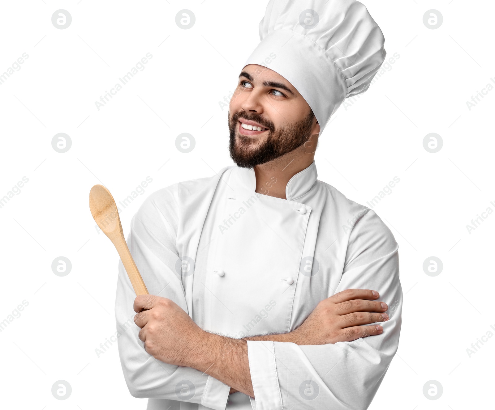 Photo of Happy young chef in uniform holding wooden spoon on white background