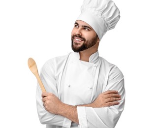 Photo of Happy young chef in uniform holding wooden spoon on white background