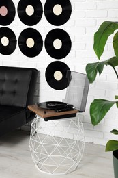 Photo of Living room decorated with vinyl records. Interior design