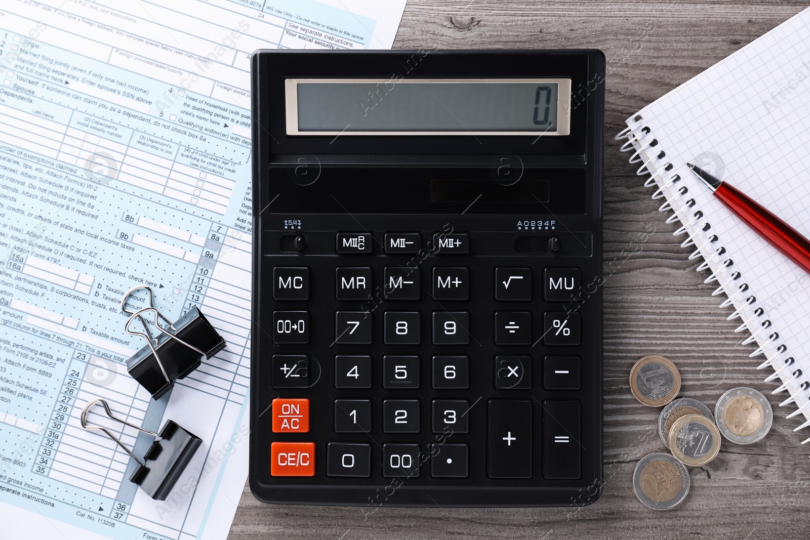 Photo of Tax accounting. Flat lay composition with calculator and document on wooden table