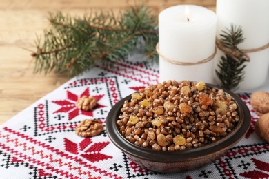 Photo of Traditional Christmas slavic dish kutia served on table. Space for text