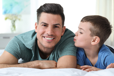 Dad and son spending time together at home. Happy Father's Day