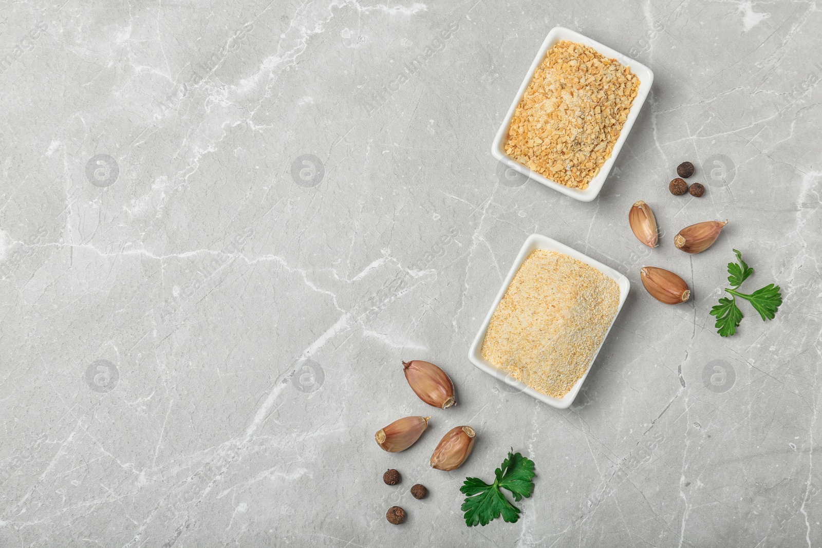 Photo of Flat lay composition with garlic products on grey background