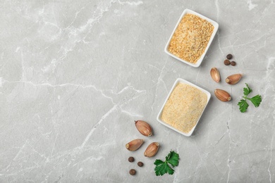 Flat lay composition with garlic products on grey background