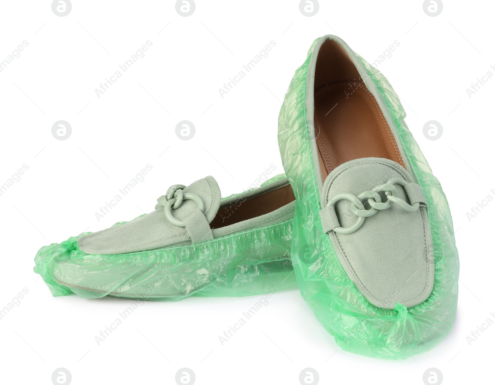 Photo of Women's mules in green shoe covers isolated on white