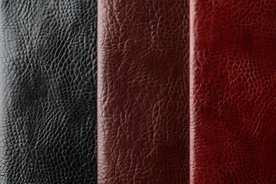 Leather samples of different colors for design as background, closeup