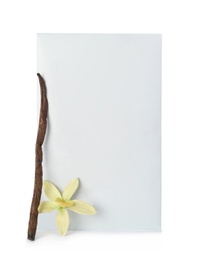Scented sachet, vanilla stick and flower on white background
