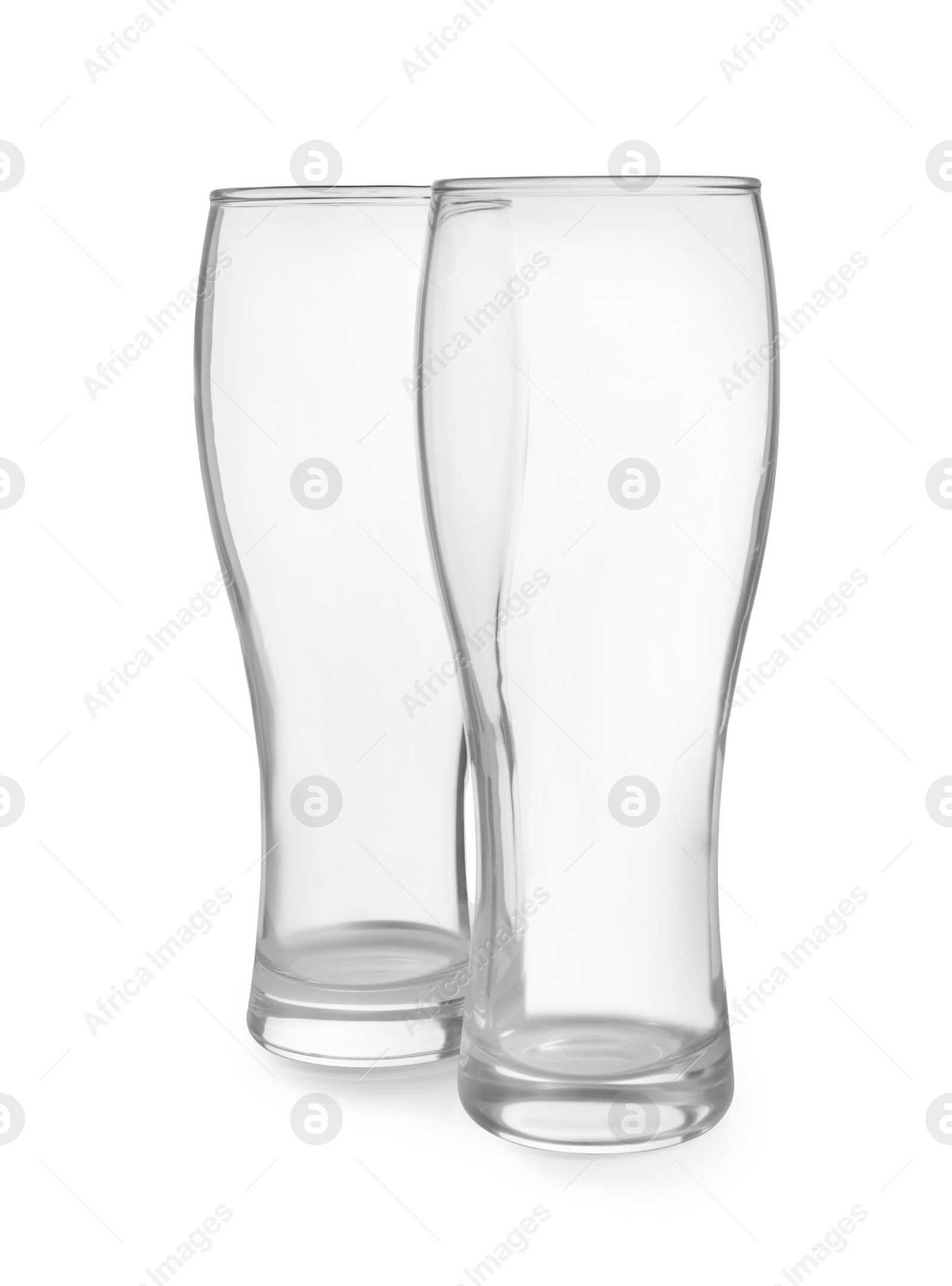 Photo of Elegant clean empty beer glasses isolated on white