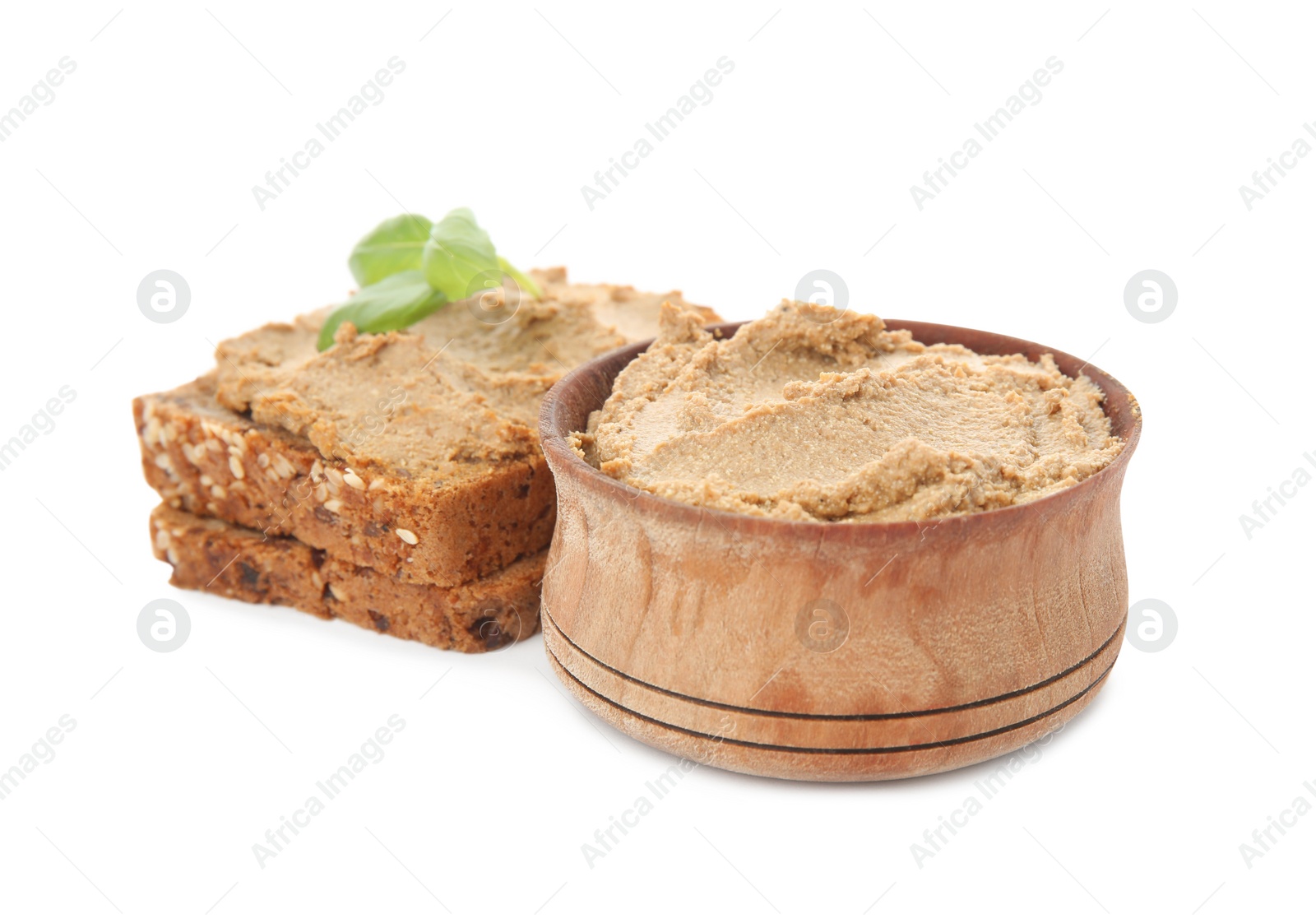 Photo of Fresh bread with delicious meat pate and basil on white background