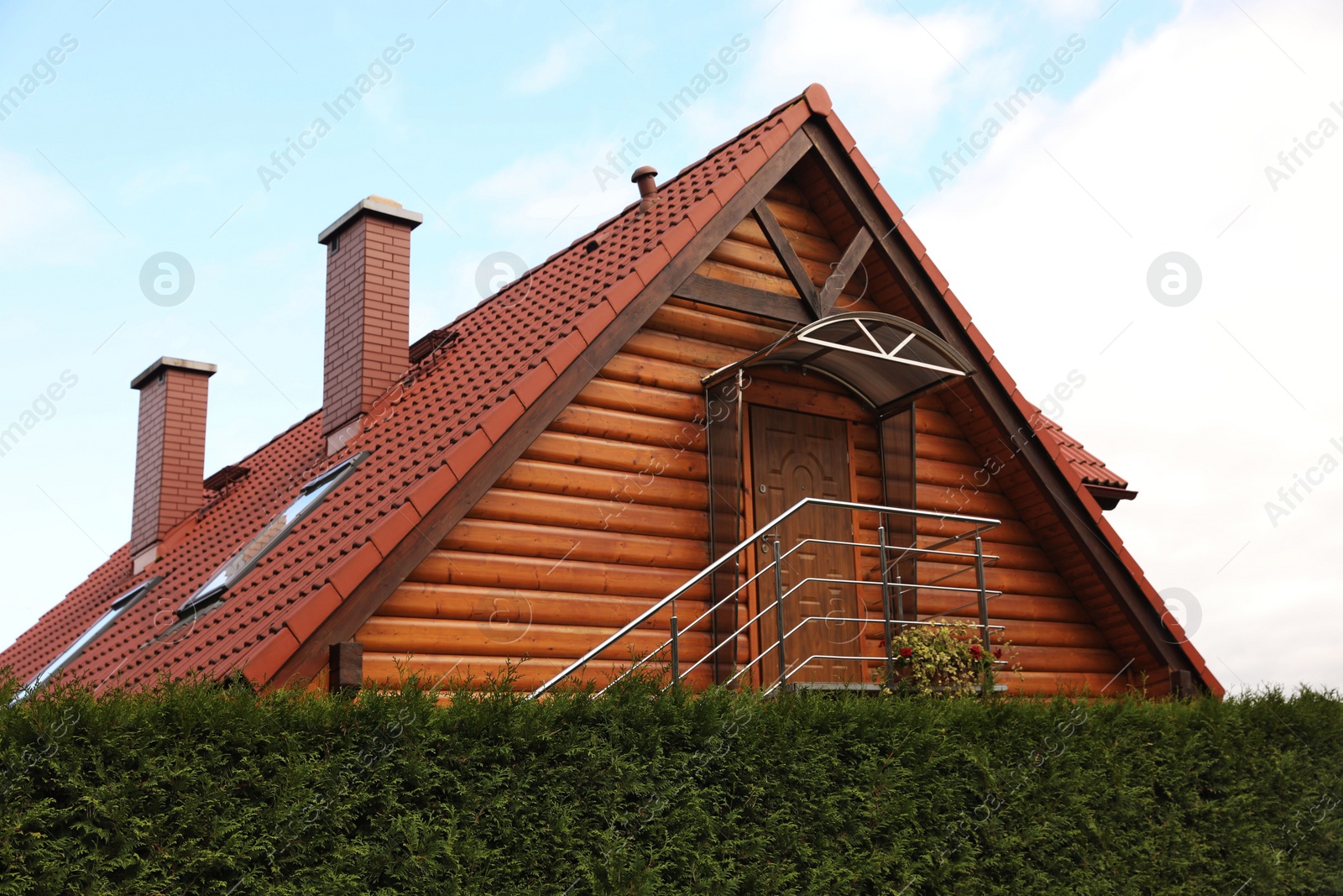 Photo of Beautiful house under cloudy sky. Real estate for rent