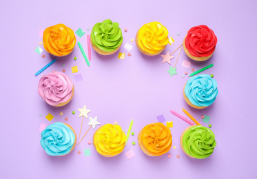 Photo of Colorful birthday cupcakes on lilac background, flat lay. Space for text