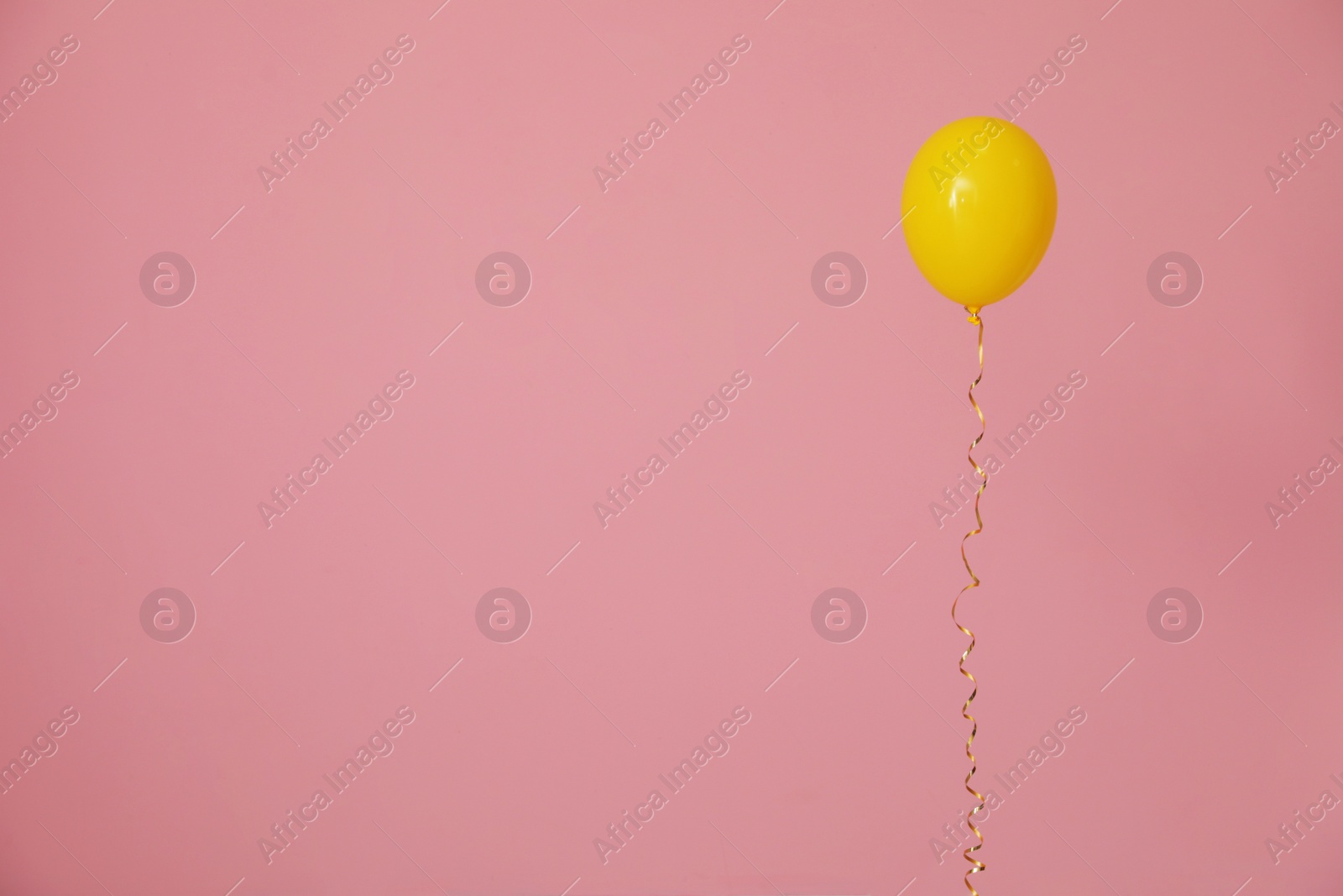 Photo of Bright balloon on color background, space for text. Celebration time