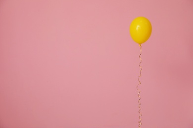 Photo of Bright balloon on color background, space for text. Celebration time