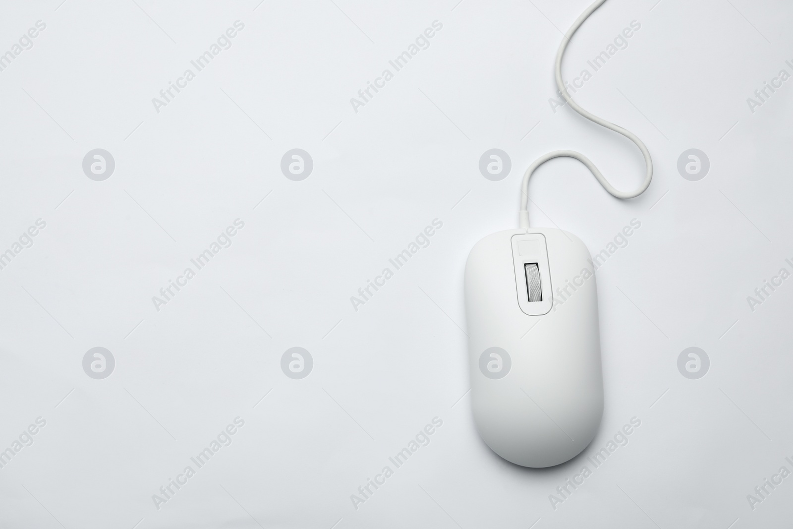 Photo of Wired computer mouse isolated on white, top view