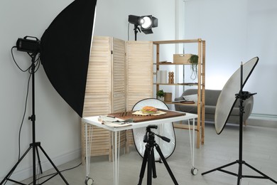 Photo of Tasty sandwich on table in photo studio. Food photography