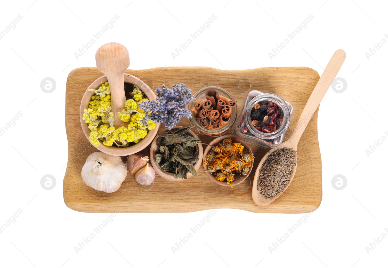 Photo of Mortar with pestle, many different dry herbs and spices isolated on white, top view