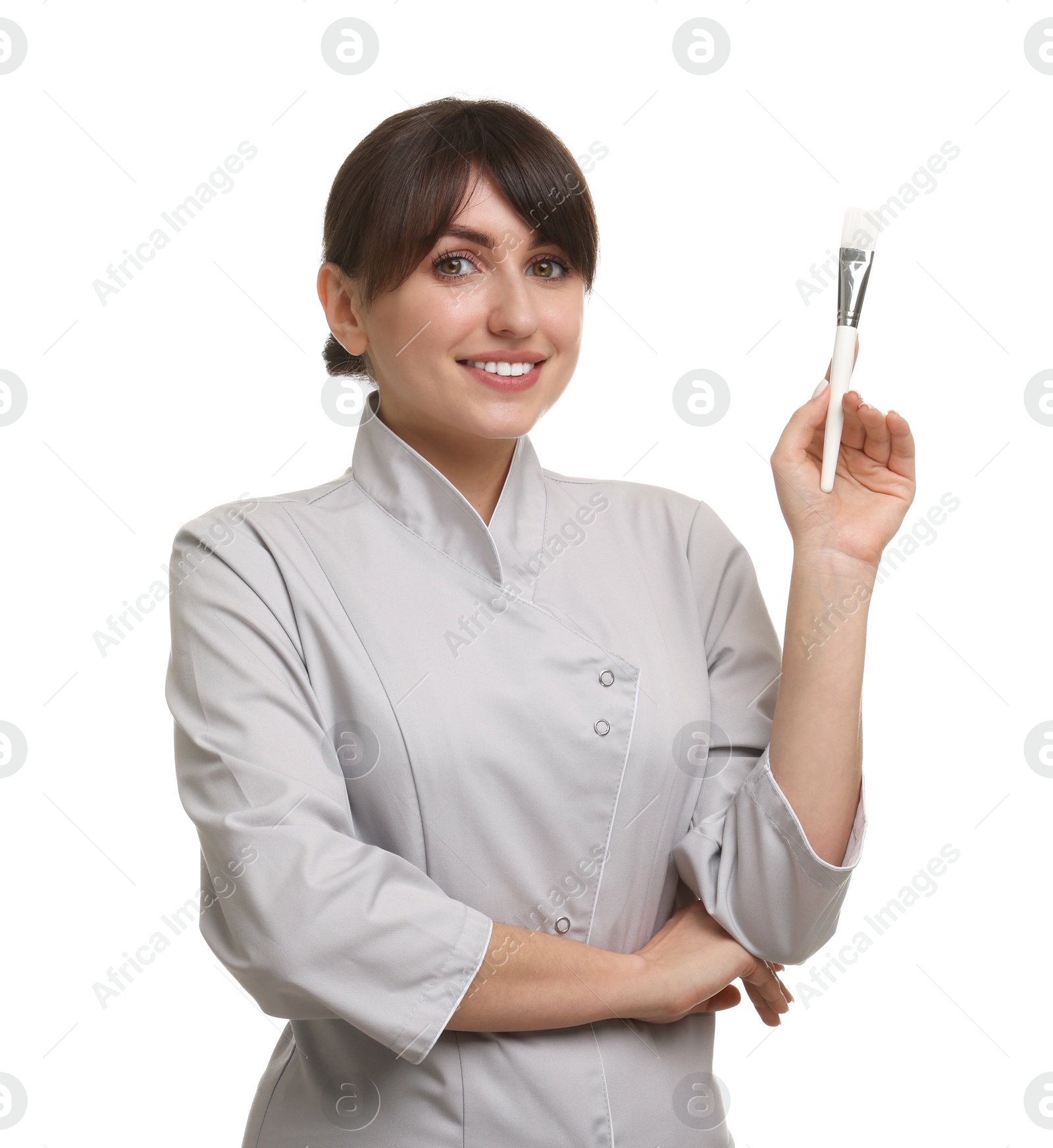 Photo of Cosmetologist with cosmetic brush on white background