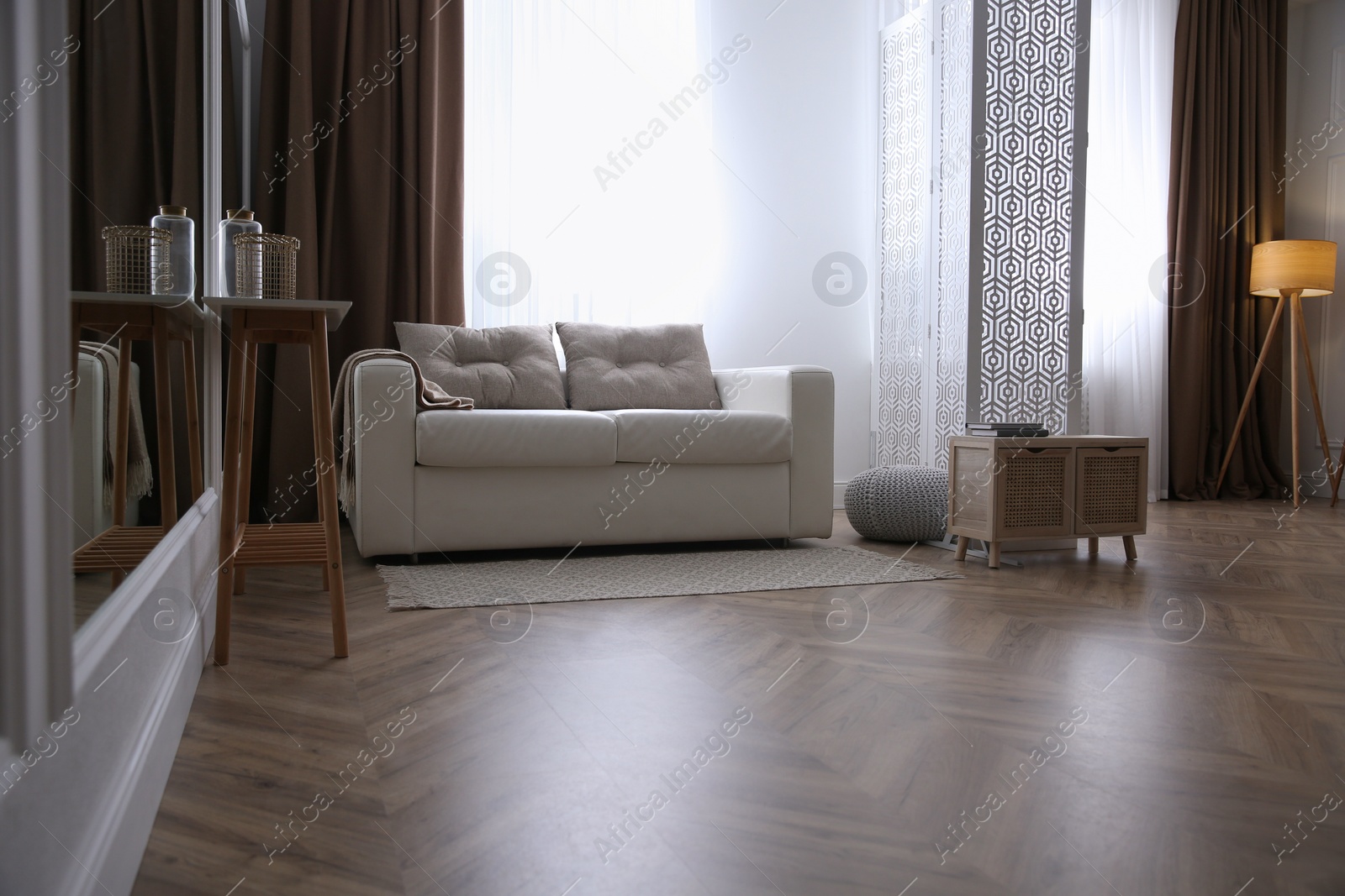 Photo of Modern living room with parquet floor and stylish furniture