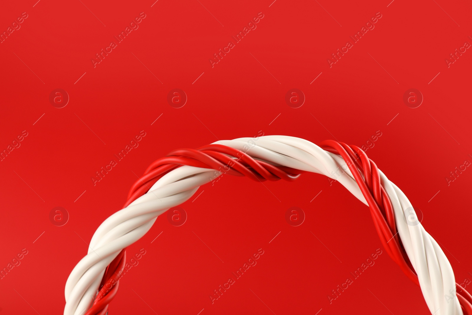 Photo of Electric wires on red background, closeup view