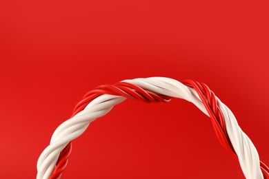 Photo of Electric wires on red background, closeup view