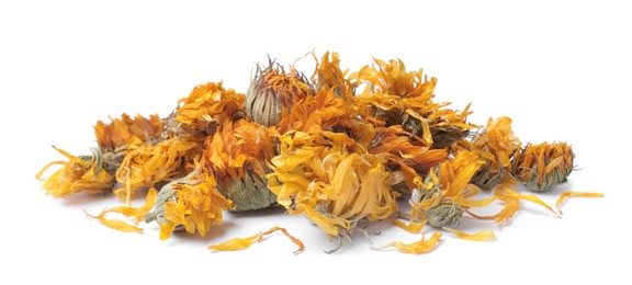 Pile of dry calendula flowers on white background