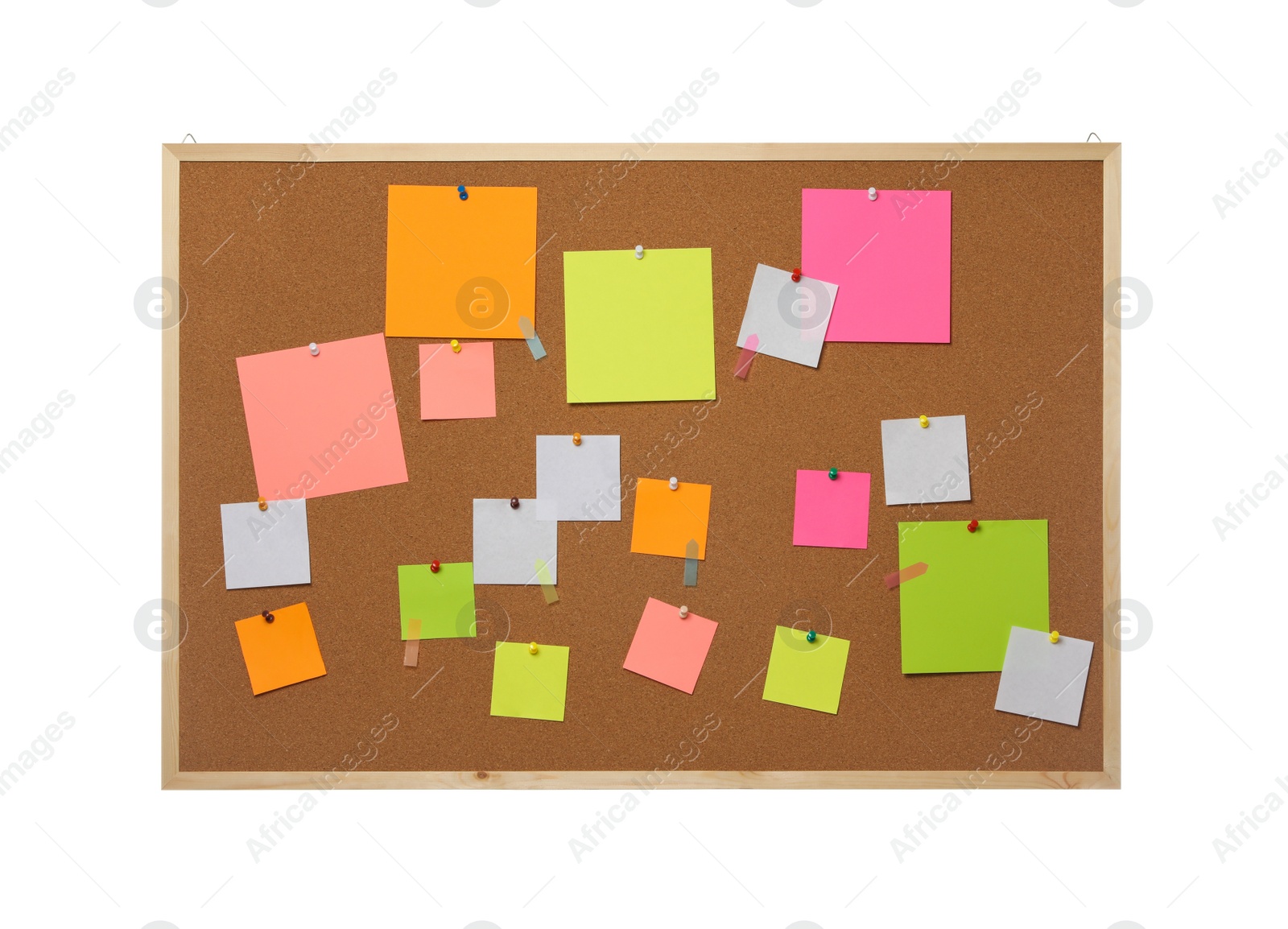 Photo of Empty notes pinned to cork board on white background