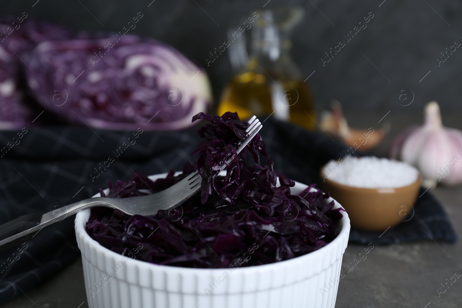 Photo of Tasty red cabbage sauerkraut on table, closeup