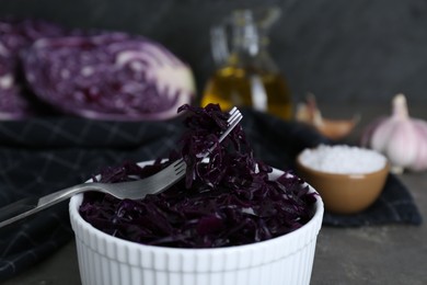 Photo of Tasty red cabbage sauerkraut on table, closeup