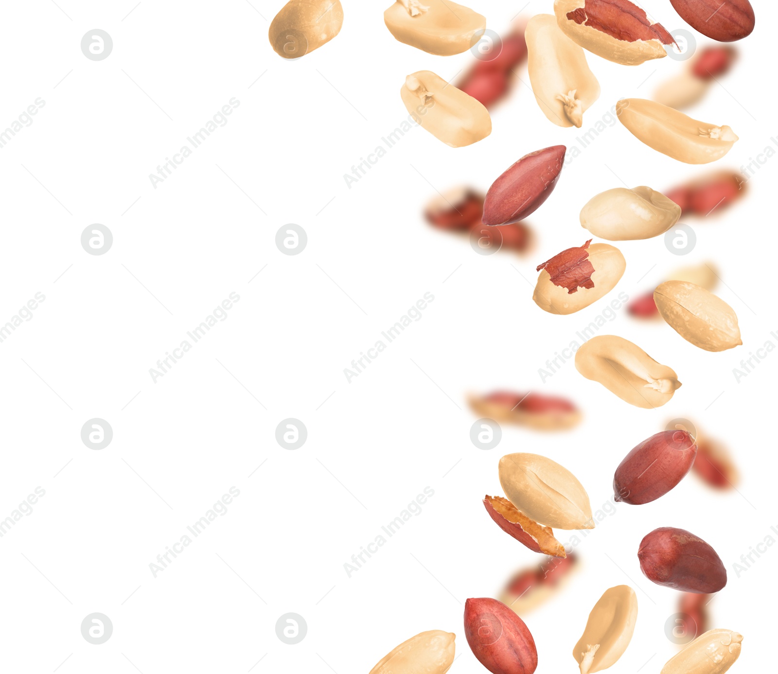 Image of Unpeeled peanuts in air on white background