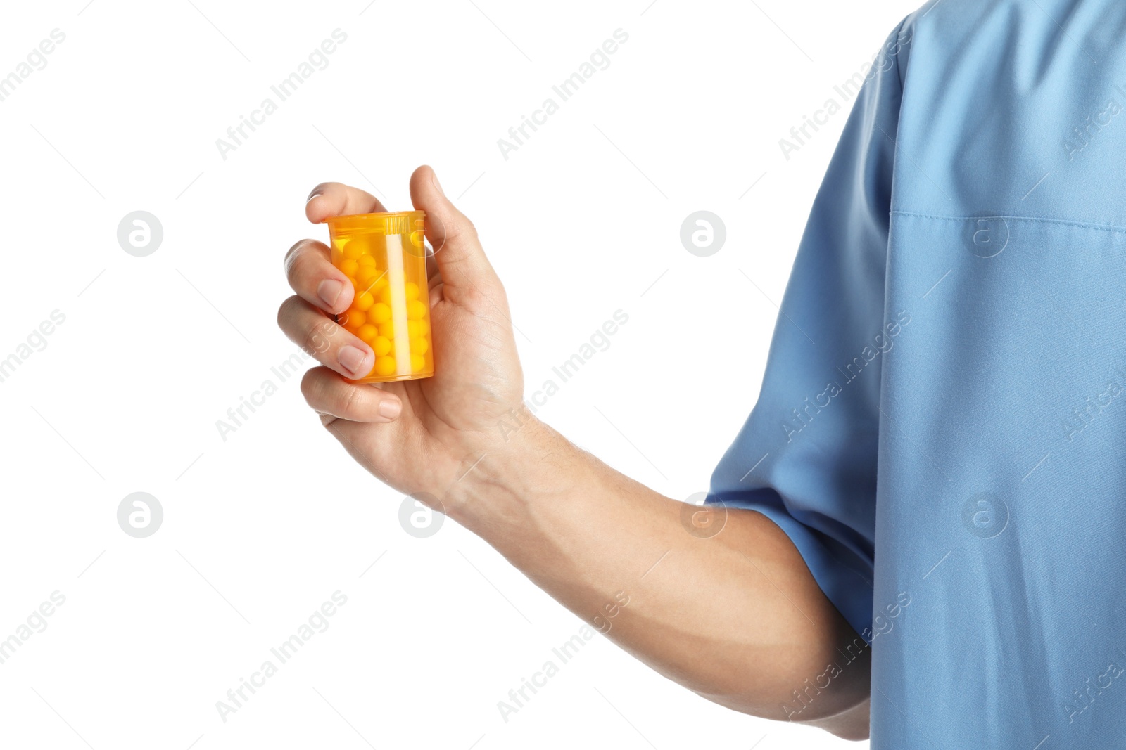 Photo of Male doctor holding pill bottle on white background, closeup. Medical object