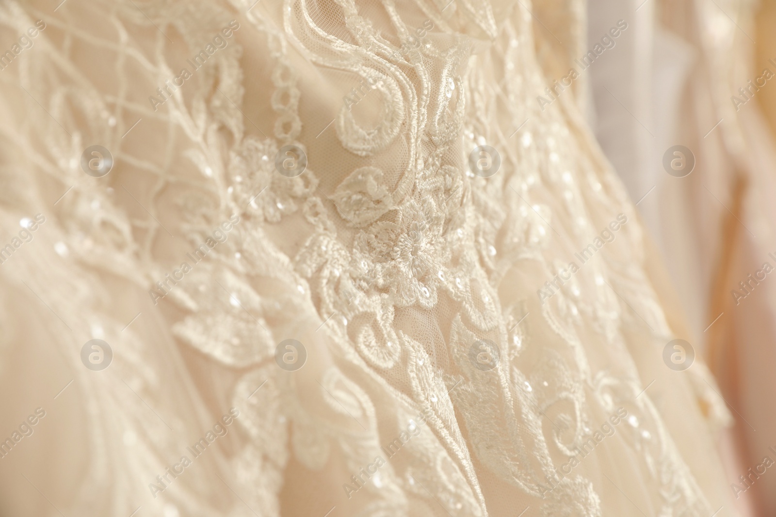 Photo of Beautiful wedding dress with lace, closeup view