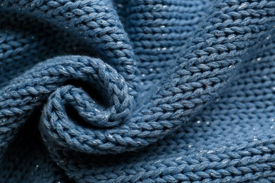 Photo of Beautiful pale blue knitted fabric as background, top view