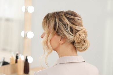 Woman with beautiful hair style in salon