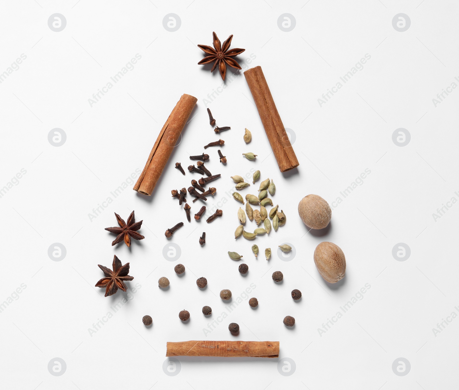 Photo of Christmas tree made of different spices on white table, flat lay