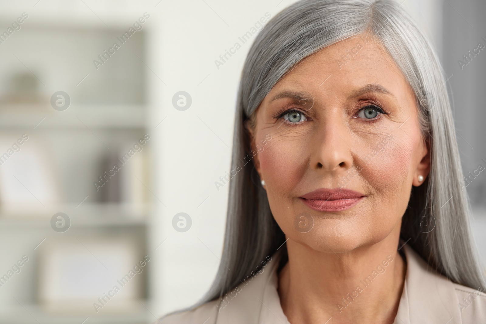Photo of Portrait of beautiful senior woman at home. Space for text