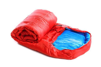 Photo of Rolled sleeping bag on white background. Camping equipment