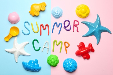 Flat lay composition with text SUMMER CAMP made of modelling clay on color background