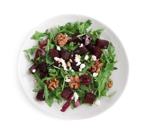 Delicious beet salad with arugula and walnuts isolated on white, top view