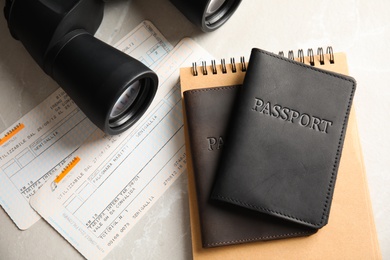 Flat lay composition with tourist items on grey background. Travel agency