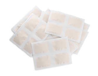 Pile of mustard plasters on white background, top view
