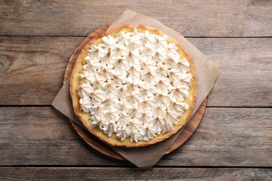 Delicious lemon meringue pie on wooden table, top view