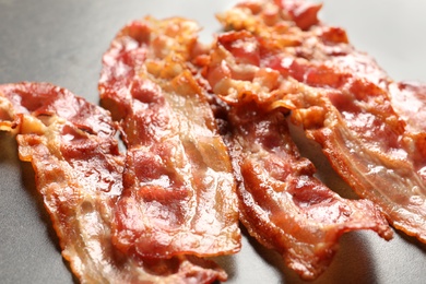 Fried bacon on grey background