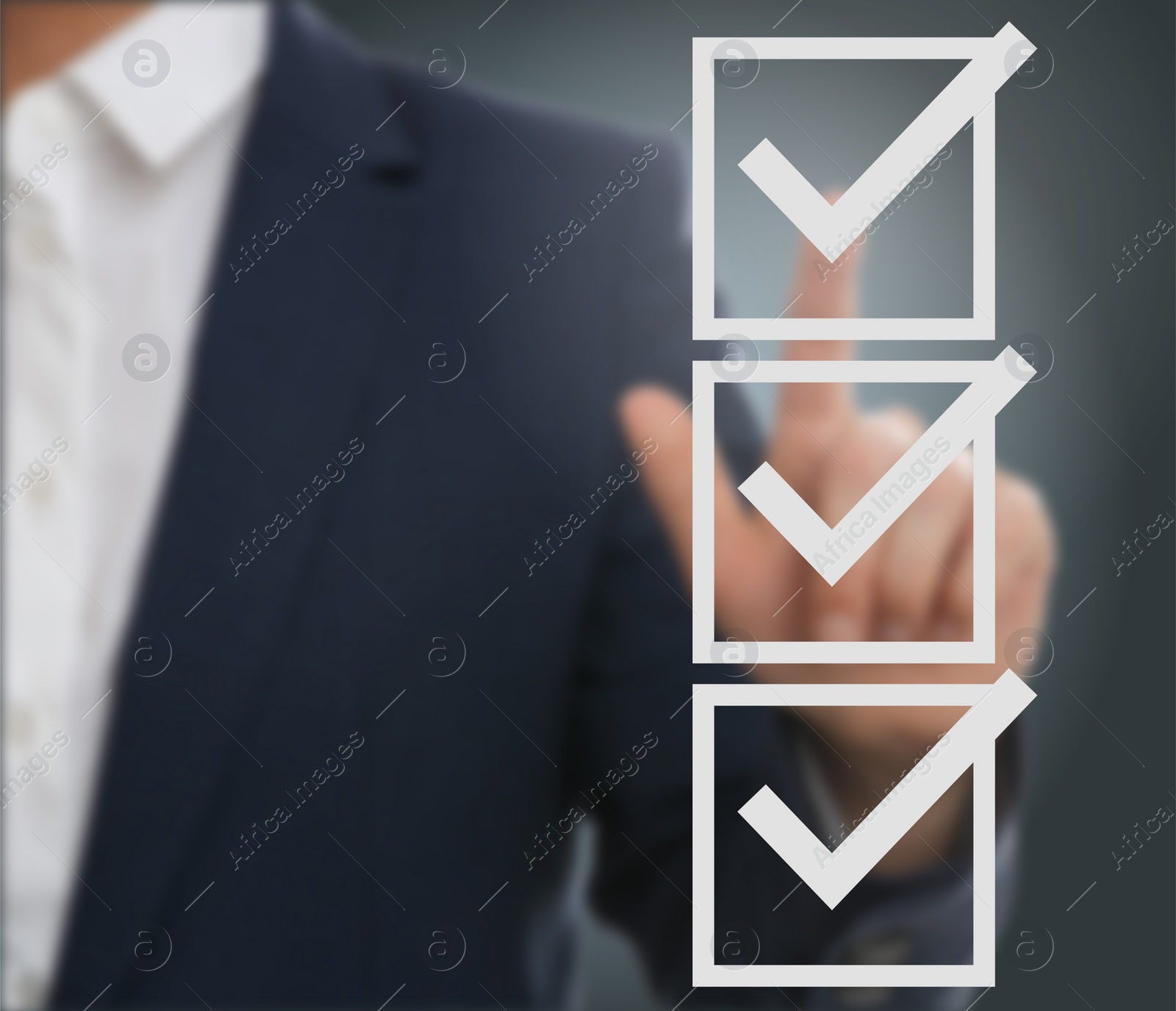 Image of Man pointing at check boxes with marks on virtual screen, closeup