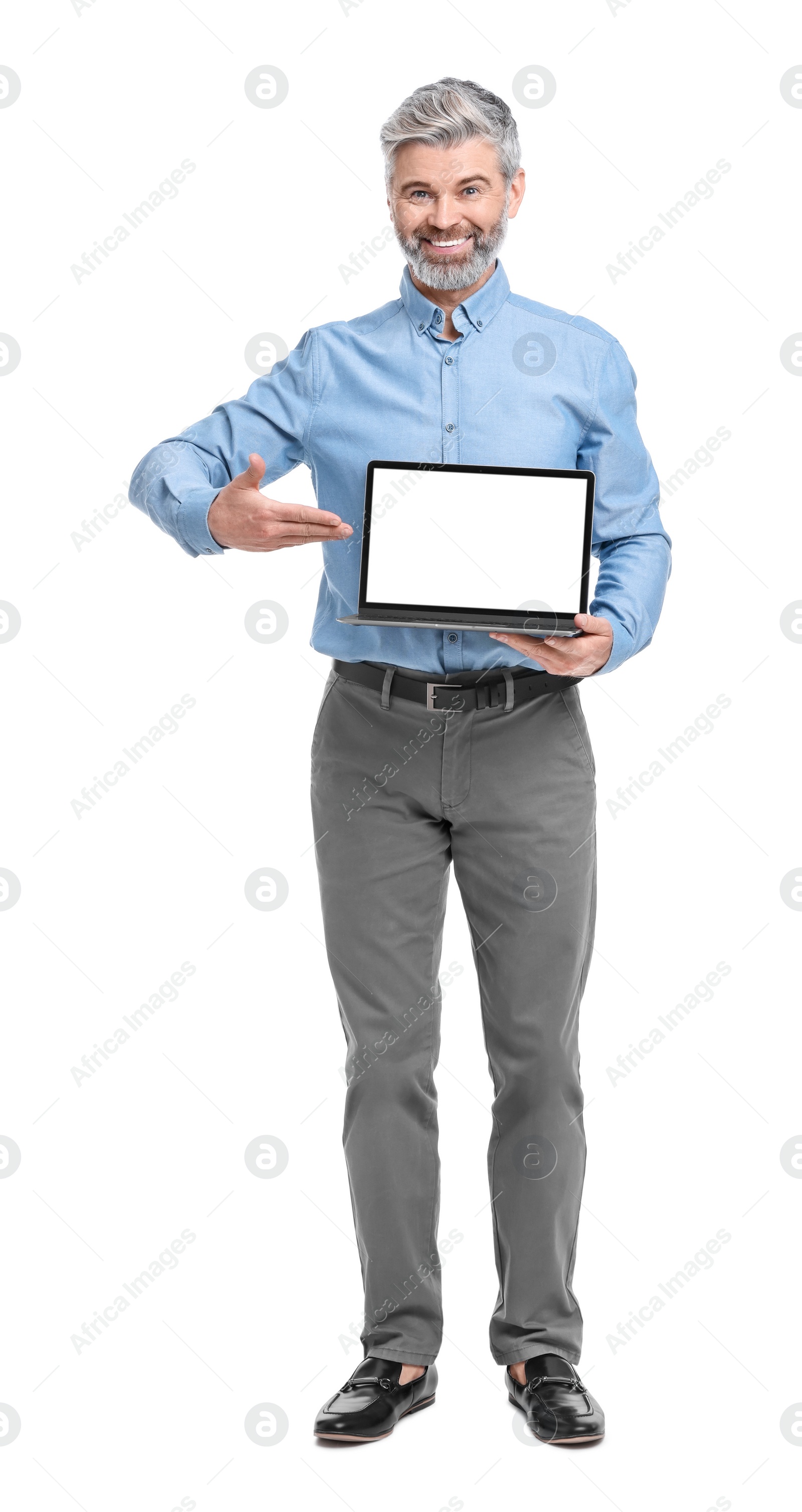 Photo of Mature businessman in stylish clothes with laptop on white background