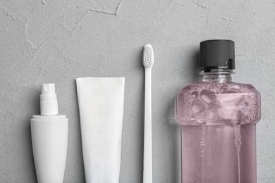 Flat lay composition with oral care  products on light background. Teeth hygiene