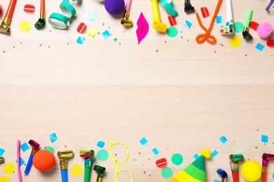 Flat lay composition with party items on wooden background. Space for text