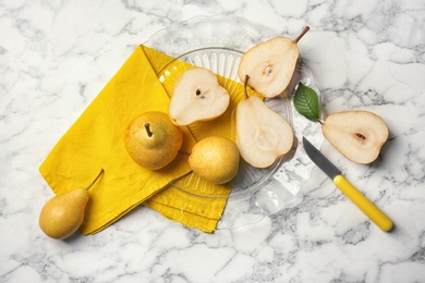 Flat lay composition with ripe pears on marble background