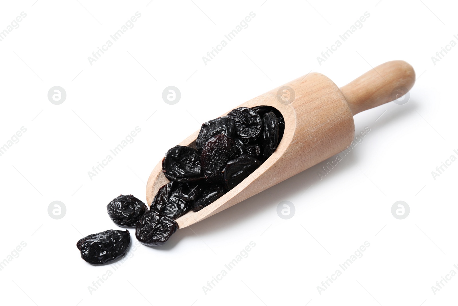 Photo of Scoop of dried plums on white background. Healthy fruit