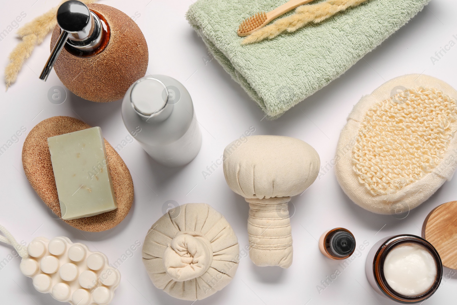 Photo of Bath accessories. Different personal care products and dry spikelets on white background, flat lay