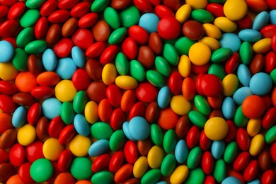 Photo of Tasty colorful candies as background, closeup view